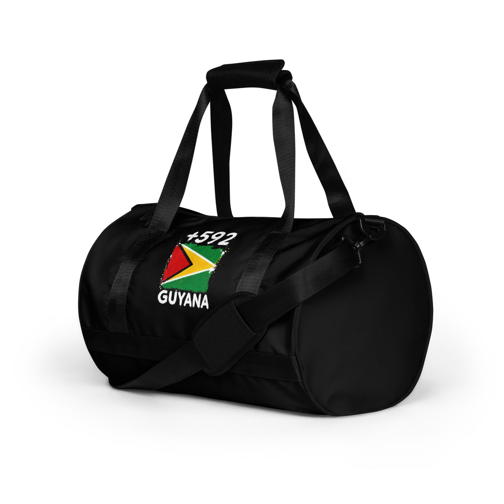 Sac de Sport Guyana +592 - Noir avec drapeau floqué effet éclaboussure de peinture - vue de trois-quarts gauche - Indicatif Fier