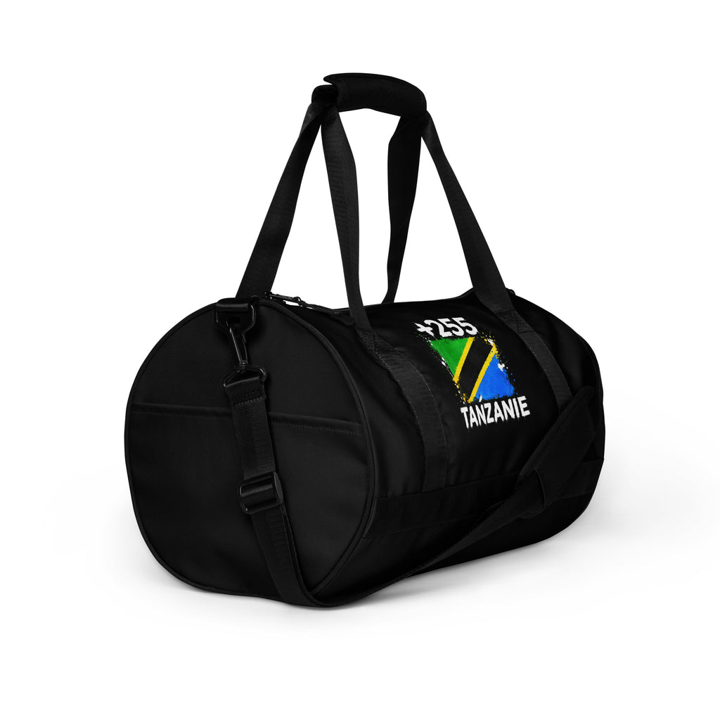 Sac de Sport Tanzanie +255 - Noir avec drapeau floqué effet éclaboussure de peinture - vue de trois-quarts droit - Indicatif Fier