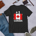T-shirt noir Canada +1 avec drapeau canadien floqué effet éclaboussure de peinture - Indicatif Fier